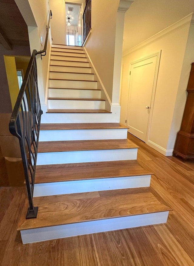 stairway featuring hardwood / wood-style flooring