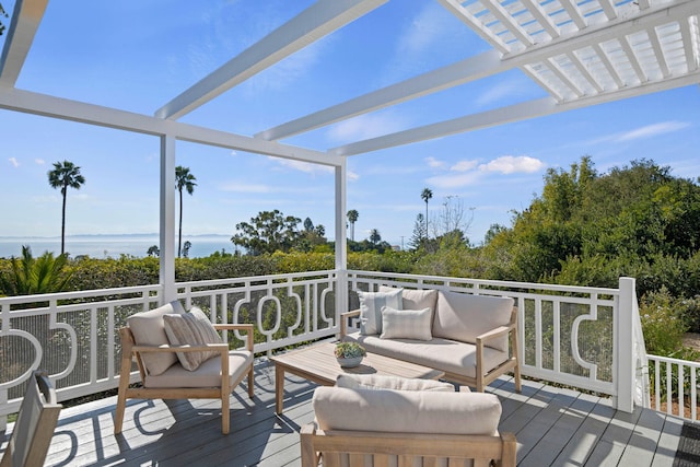 wooden terrace with outdoor lounge area and a pergola