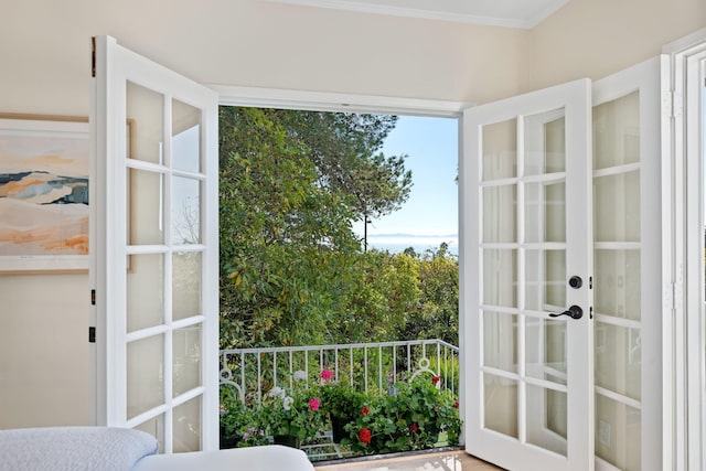 interior space with french doors and ornamental molding