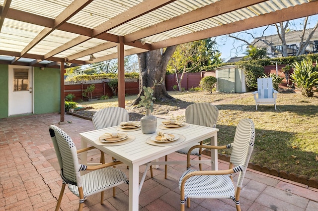 view of patio featuring a shed and a pergola