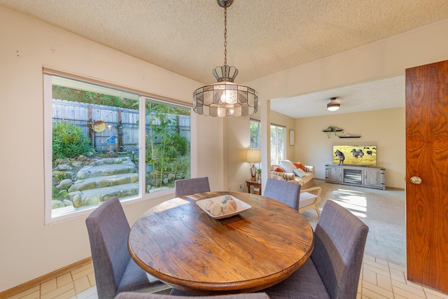 dining space with a textured ceiling