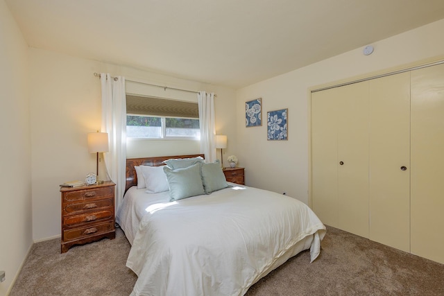 carpeted bedroom with a closet