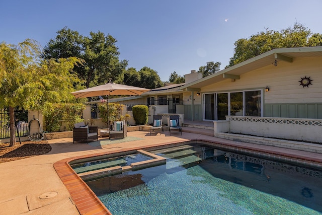 view of swimming pool with a patio area