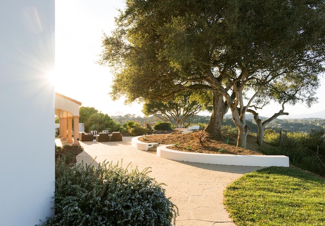 view of property's community with a patio and outdoor lounge area