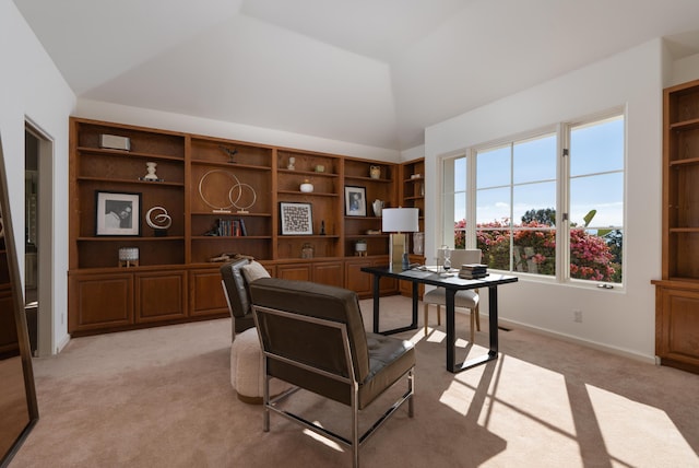 carpeted office space with lofted ceiling