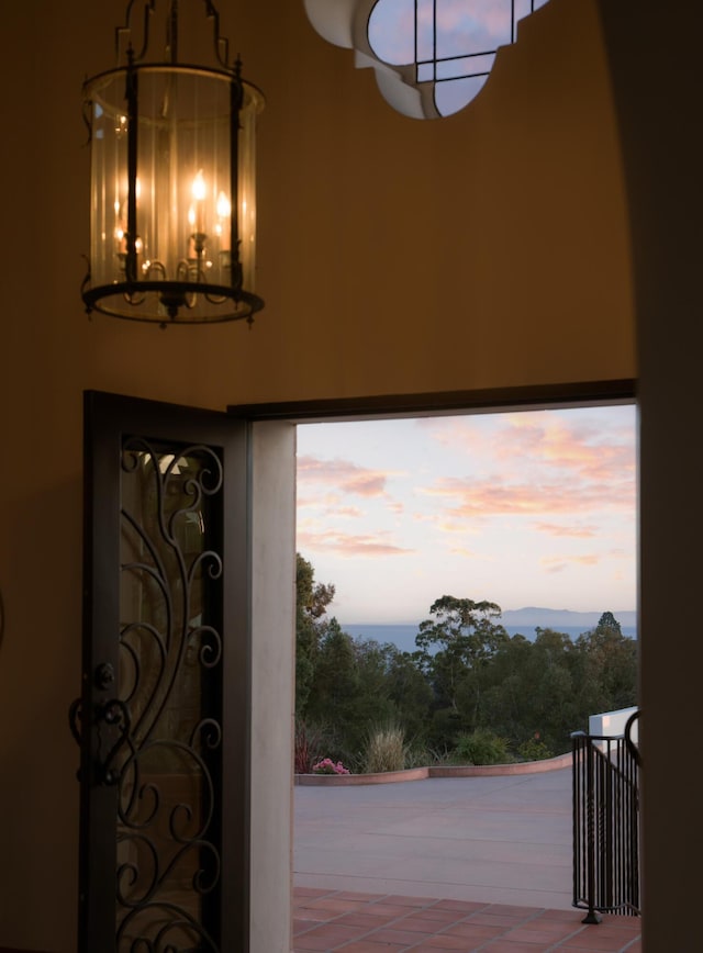 foyer with a healthy amount of sunlight and a chandelier