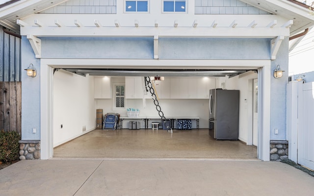 garage with stainless steel fridge