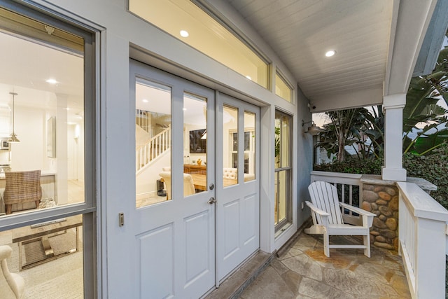 exterior space with french doors and covered porch