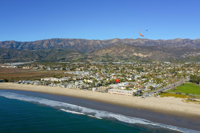 birds eye view of property featuring a beach view and a water and mountain view