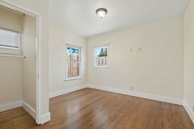 unfurnished room featuring hardwood / wood-style floors