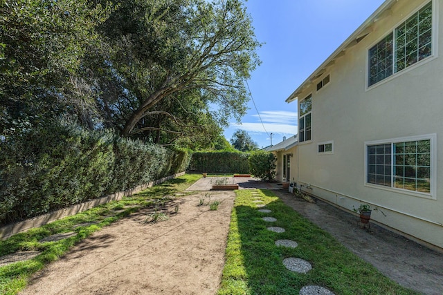 view of yard with a patio area and a fenced backyard