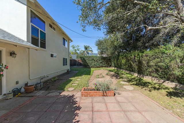 view of yard featuring a fenced backyard and a patio