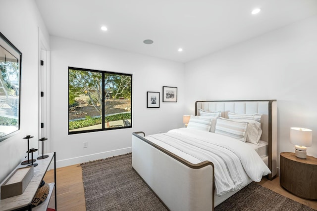 bedroom with hardwood / wood-style floors