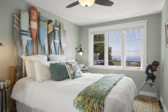 bedroom featuring hardwood / wood-style floors and ceiling fan