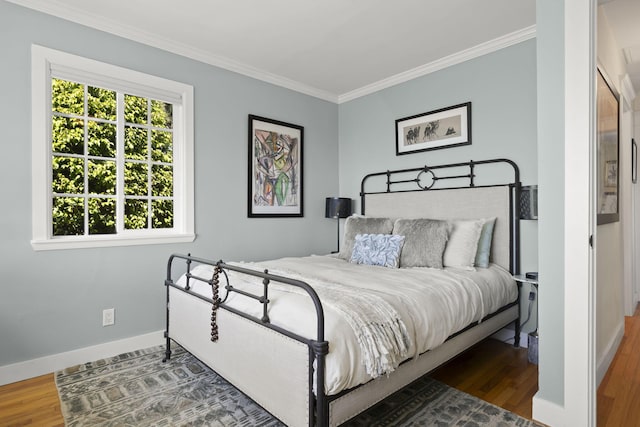 bedroom with dark wood-type flooring and ornamental molding