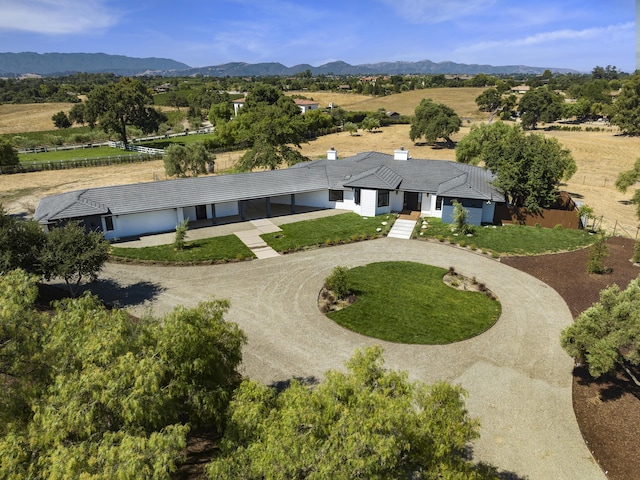 drone / aerial view featuring a mountain view