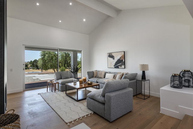 living room featuring beamed ceiling, wood-type flooring, and high vaulted ceiling