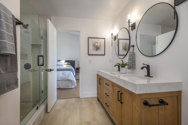 bathroom with walk in shower and vanity