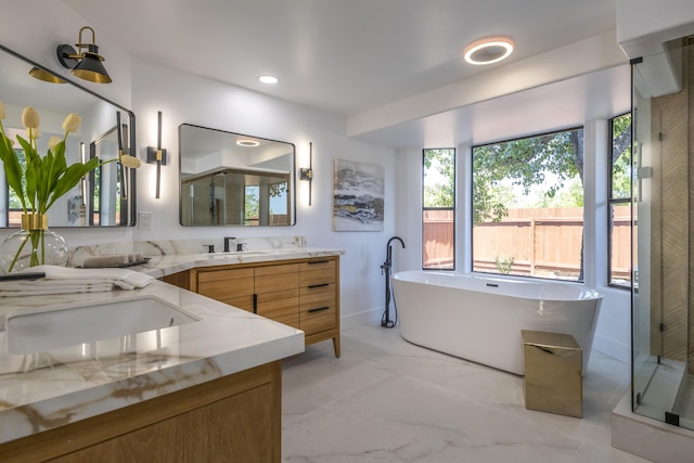 bathroom featuring vanity and separate shower and tub