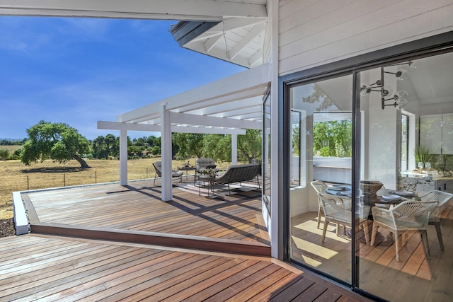 wooden deck with an outdoor hangout area and a pergola