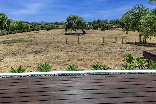 view of yard featuring a mountain view and a rural view