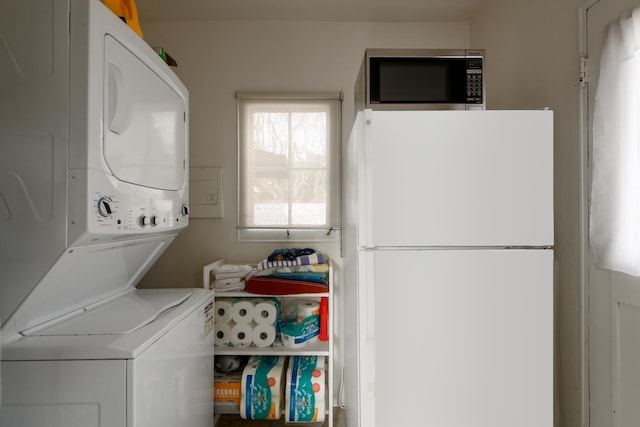 washroom with stacked washer / dryer