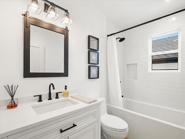 full bathroom featuring shower / bath combination with curtain, vanity, and toilet