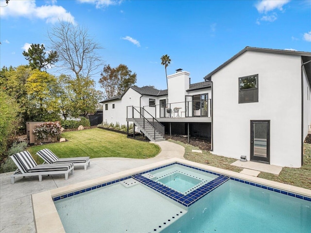 back of house featuring a yard, stucco siding, stairway, a patio area, and a deck