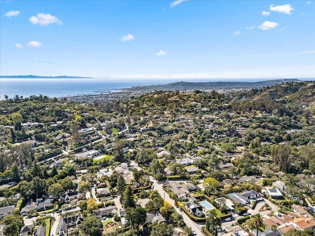 drone / aerial view with a residential view and a water view