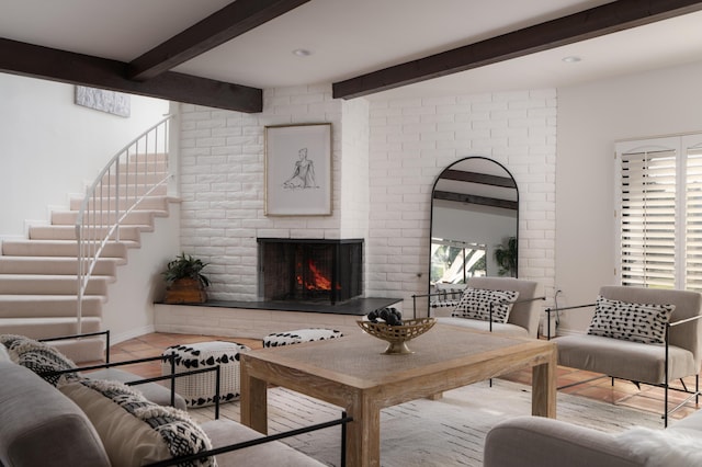 living room with beamed ceiling, light tile patterned floors, and a fireplace