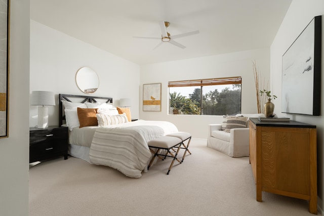 carpeted bedroom featuring ceiling fan and vaulted ceiling