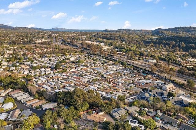 birds eye view of property featuring a mountain view