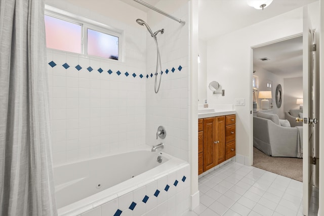 bathroom featuring vanity, shower / bathtub combination with curtain, and tile patterned floors