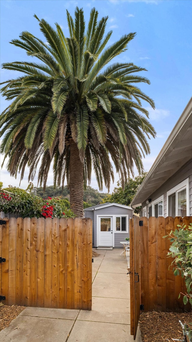 exterior space featuring an outbuilding and fence