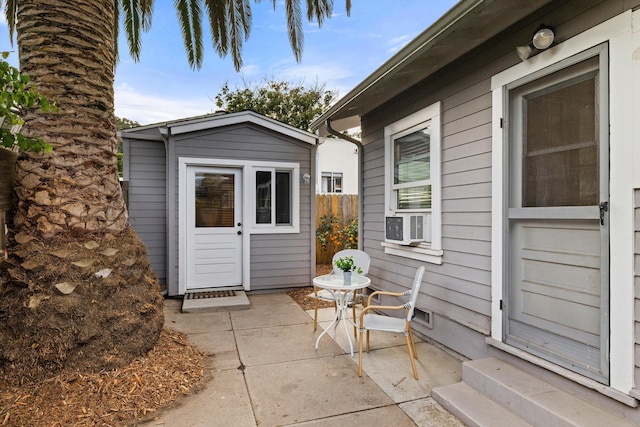 view of patio featuring an outbuilding