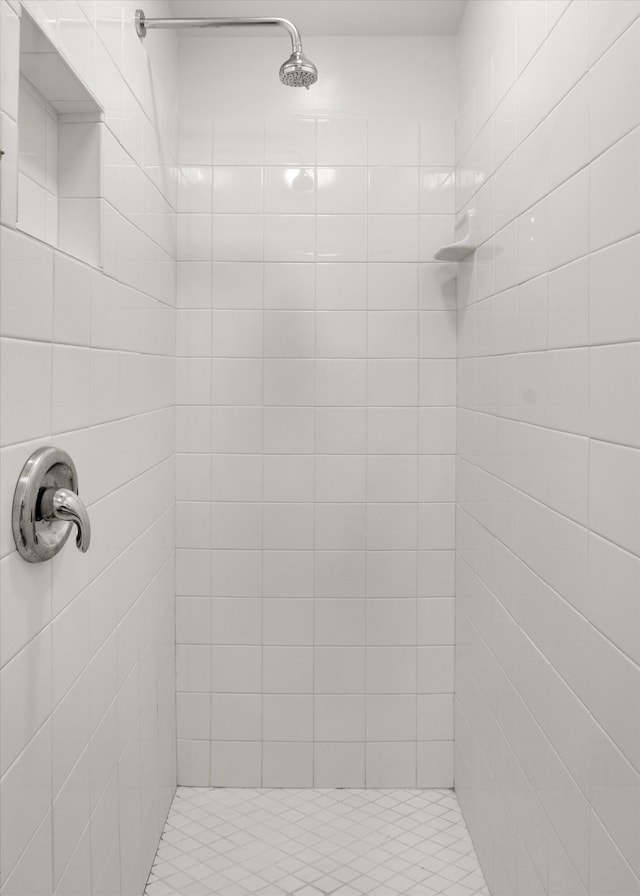 bathroom with a tile shower