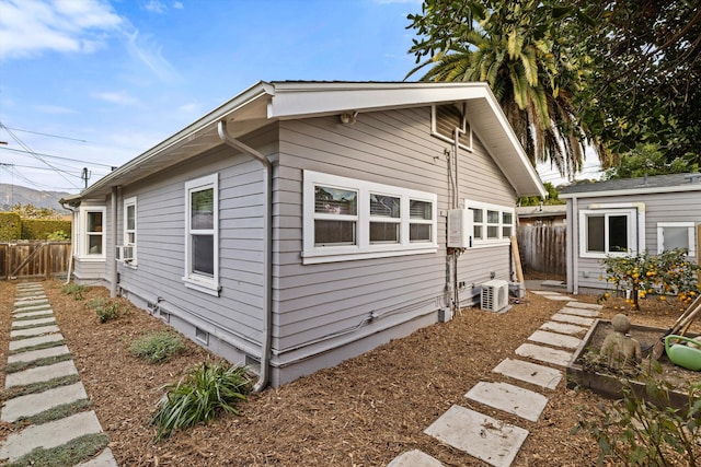 view of home's exterior with fence