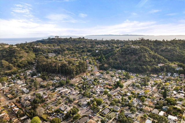 birds eye view of property featuring a water view and a residential view