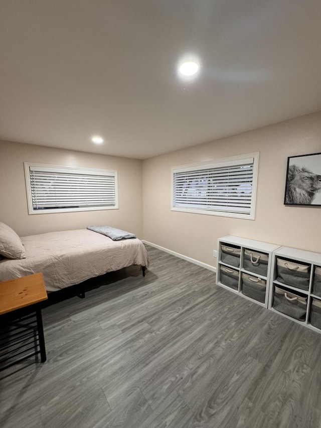 bedroom with dark wood-type flooring