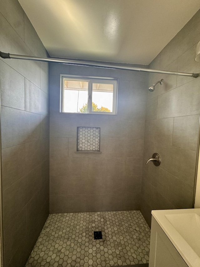 bathroom with tiled shower