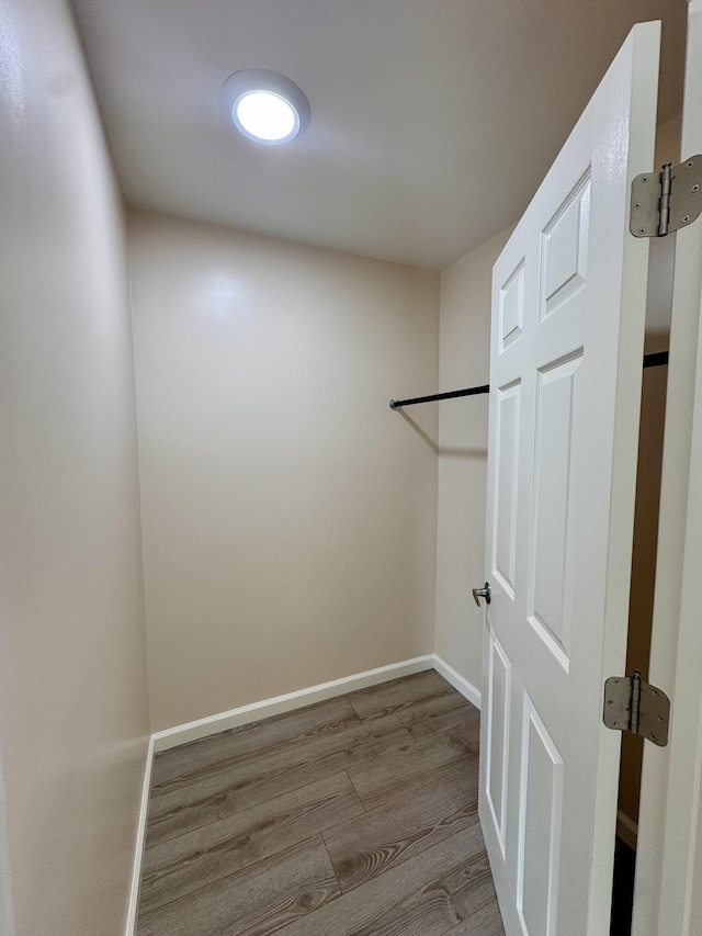 spacious closet with light hardwood / wood-style floors