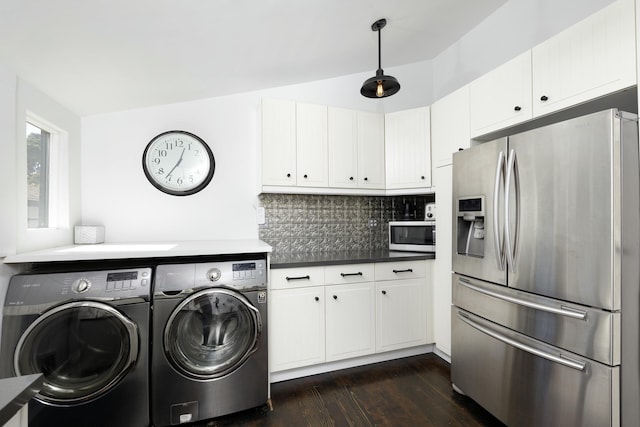 washroom with dark hardwood / wood-style floors and washer and dryer