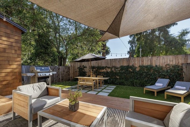 view of patio / terrace with a grill, an outdoor living space, and a wooden deck