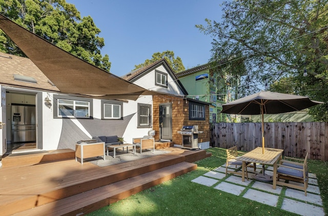 back of house featuring a wooden deck and an outdoor living space