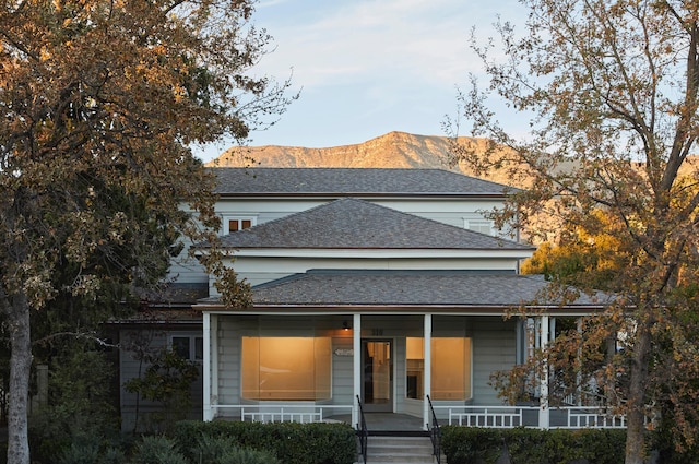 view of front of house featuring a mountain view and covered porch