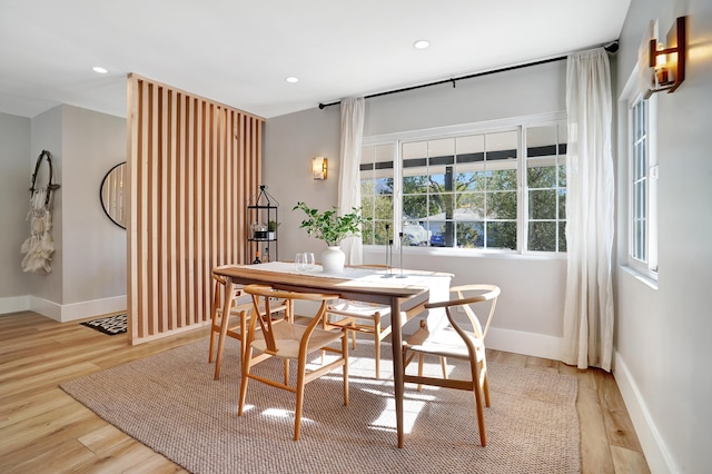 dining area with light hardwood / wood-style floors