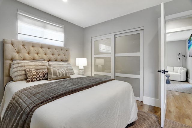 bedroom with wood-type flooring