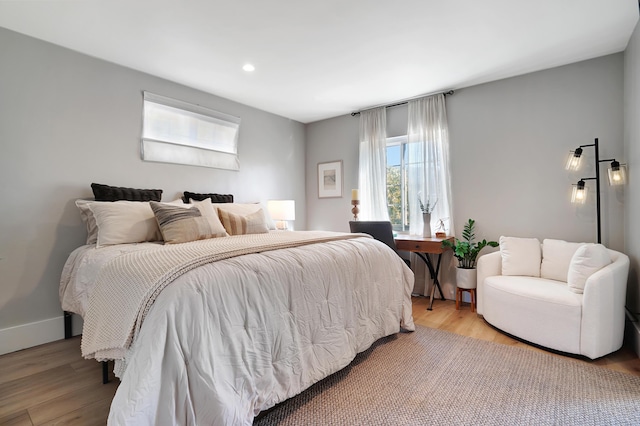 bedroom with light wood-type flooring