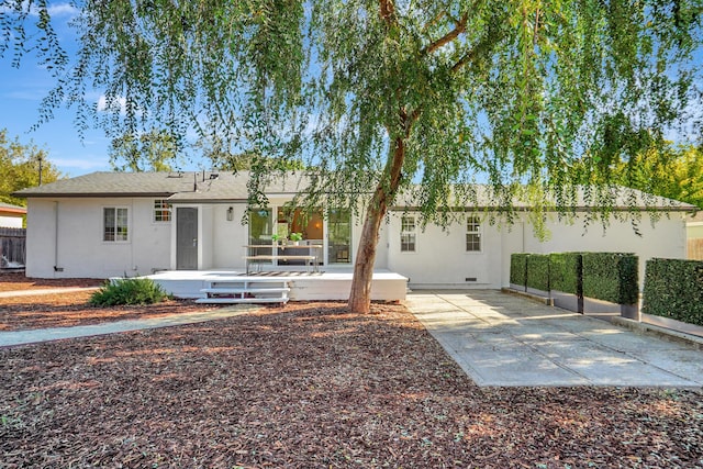 back of house with a patio