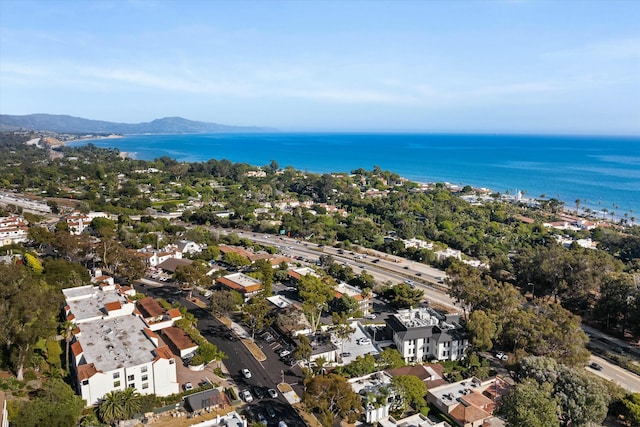 birds eye view of property with a water and mountain view